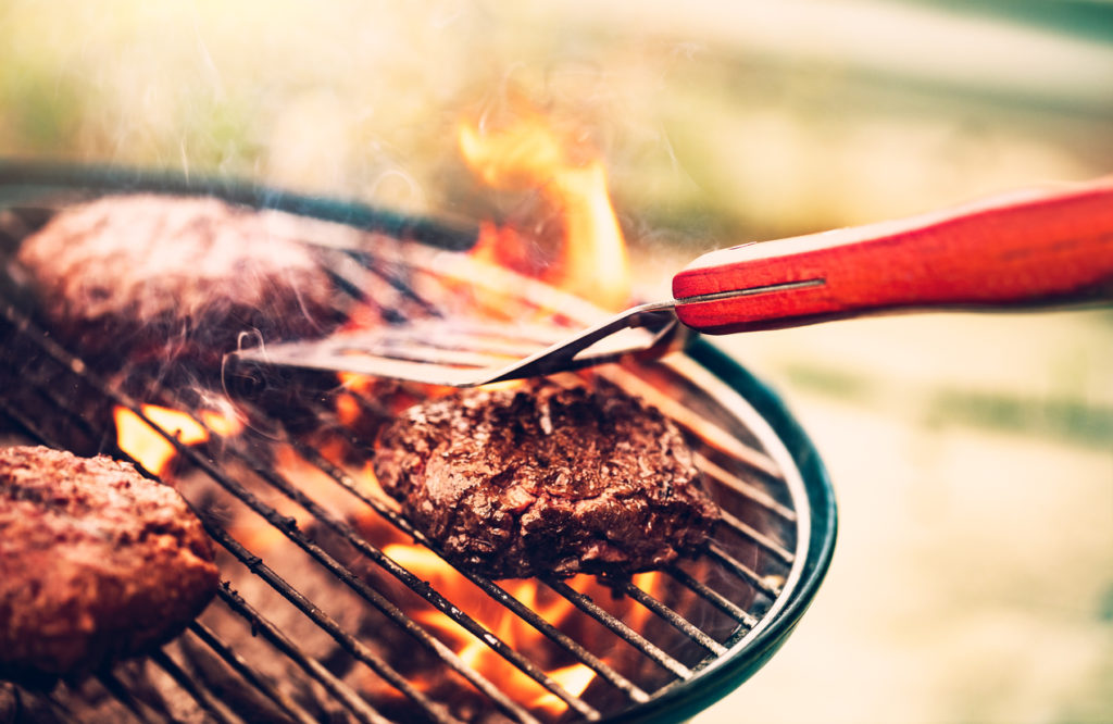 burgers over flame on a grill