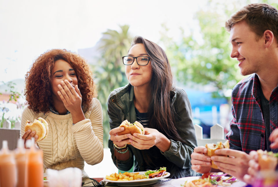 friends eating at restaurant together