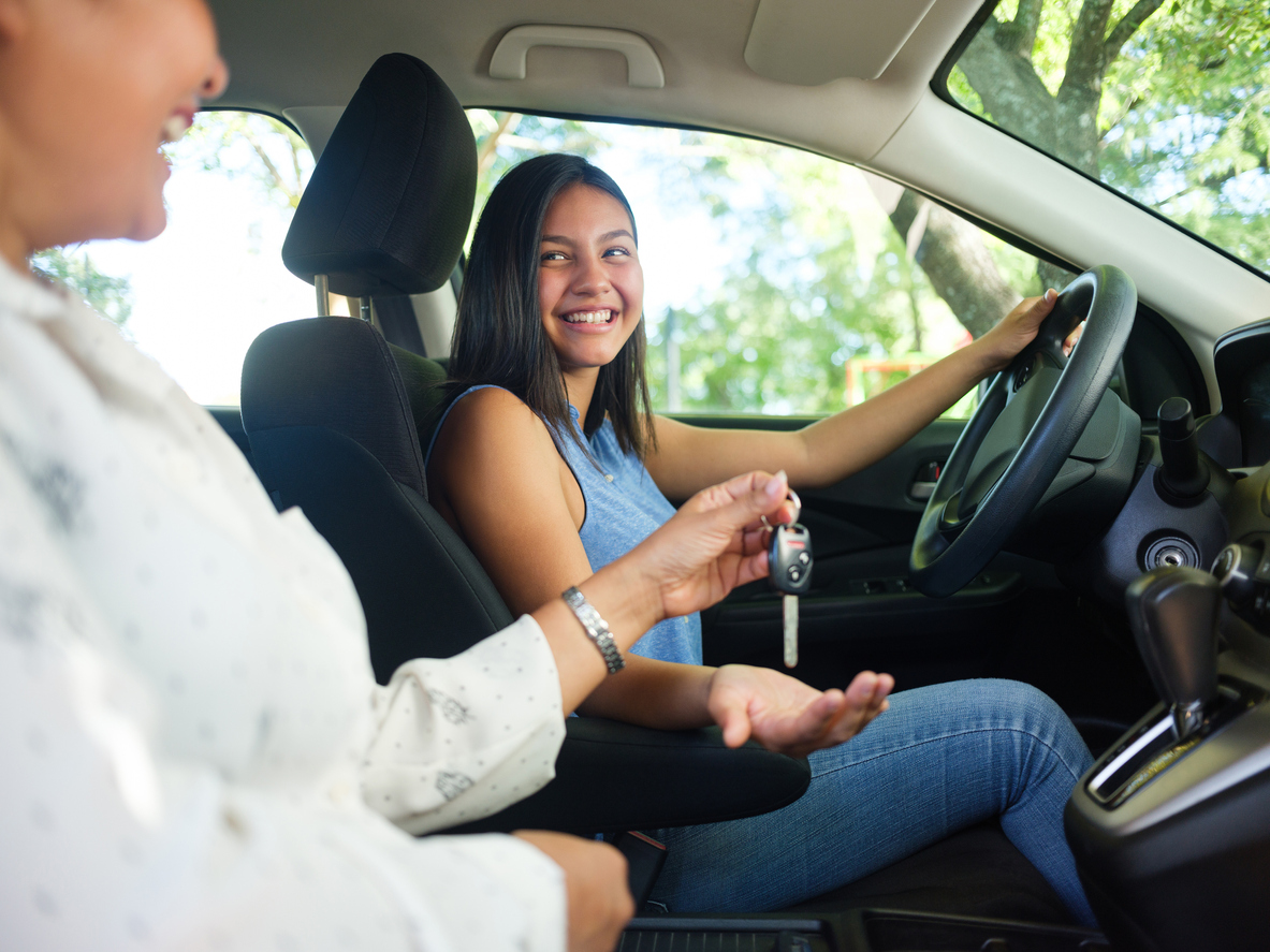 Teenage girl driving for the first time