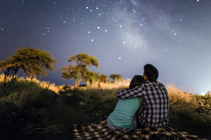 couple in love under stars of Milky Way Galaxy