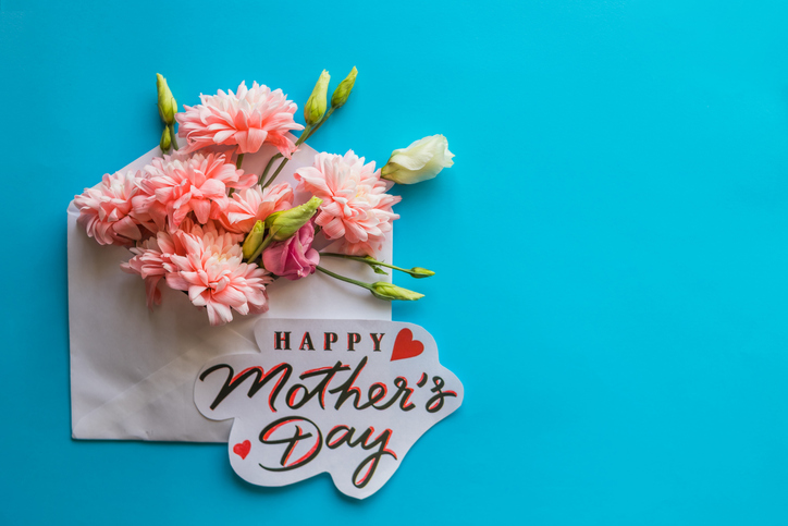 Festive composition with text HAPPY MOTHER'S DAY. Greeting Card with Spring Bouquet.
