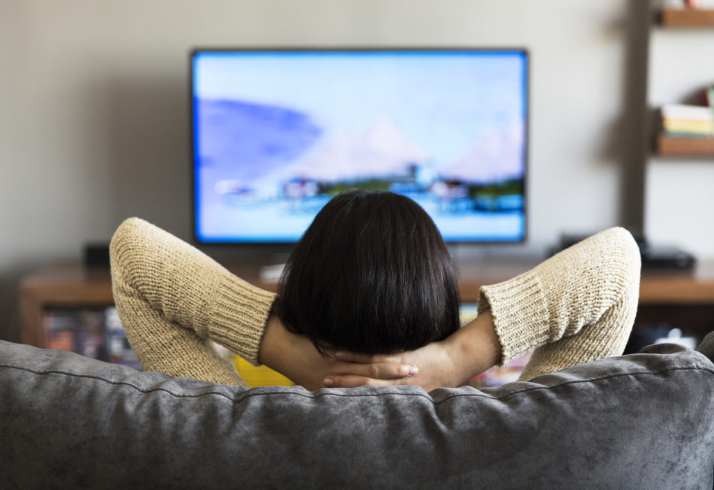 young woman watching television