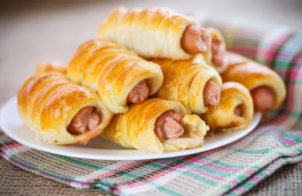 sausage baked in dough on the table